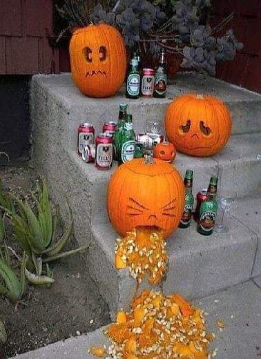 Funny Halloween pumpkins drinking beer and one of them is throwing up