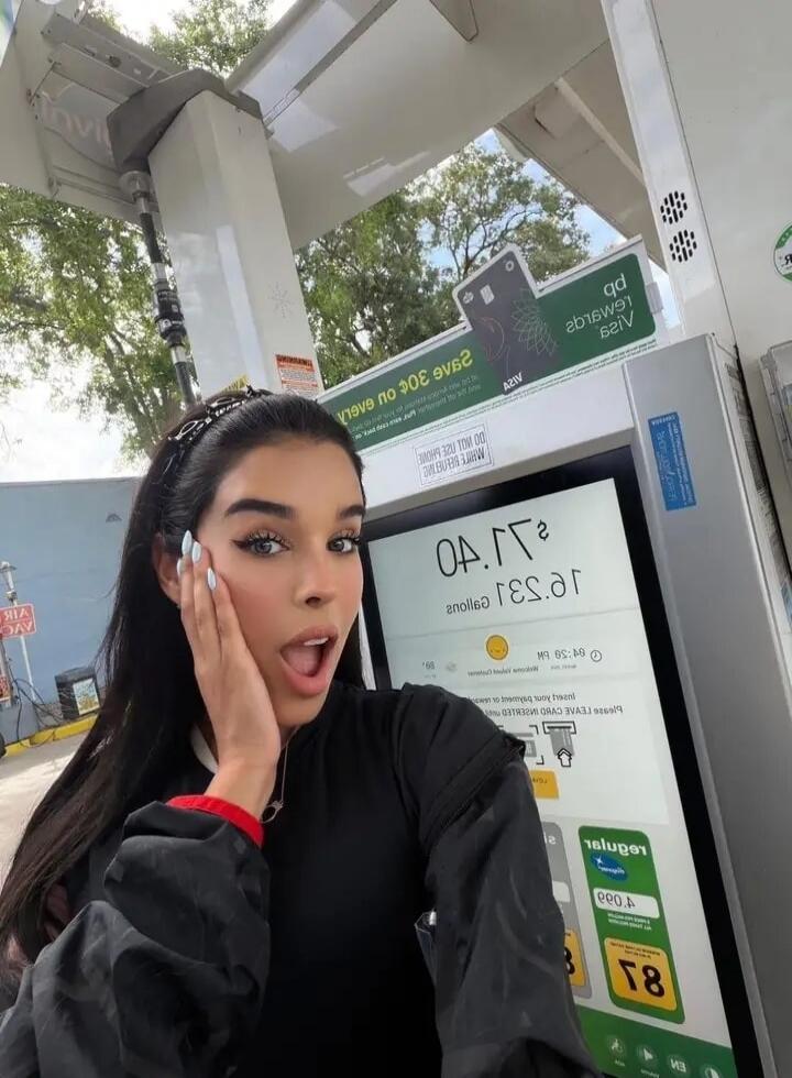Save $0.30 on every gallon. Visa Rewards. 25.31 gallons. $0.40. Regular. 87. E15. E85. Insert card. Welcome. A woman with a surprised expression, possibly reacting to the gas price or amount.