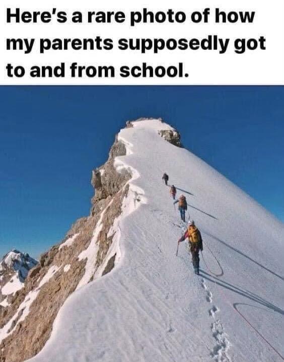 Here's a rare photo of how my parents supposedly got to and from school. The image shows several people climbing a snowy mountain ridge.