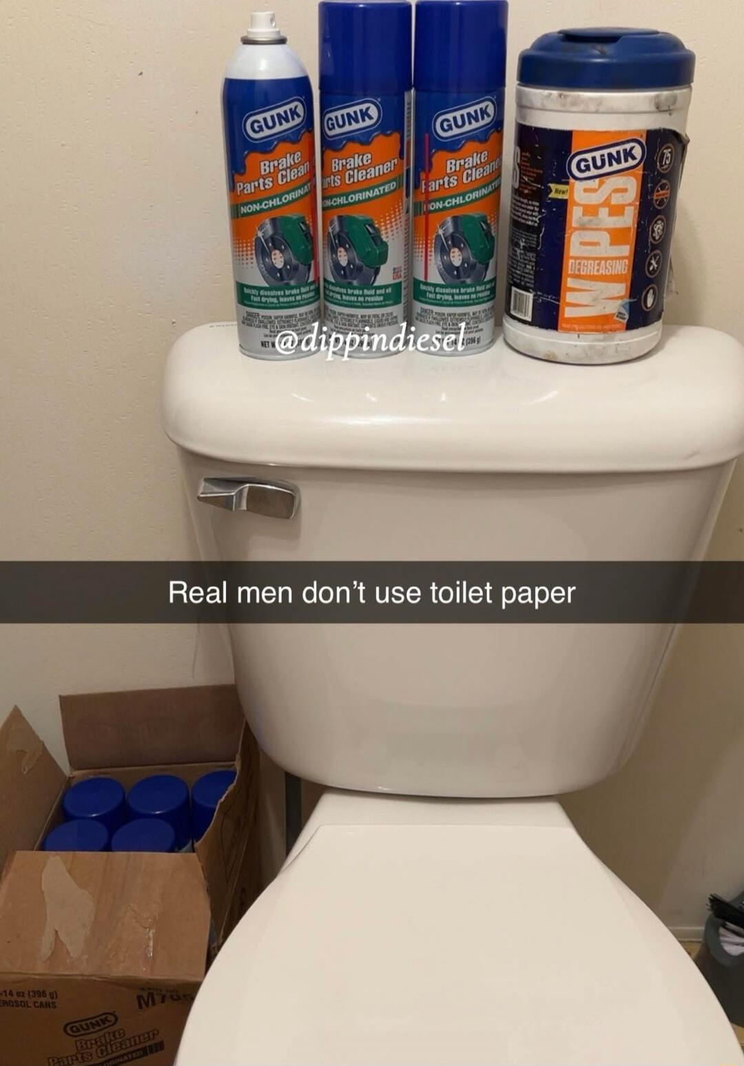 Real men don't use toilet paper. GUNK Brake Parts Cleaner cans on a toilet tank; watermark @dippindiesel.