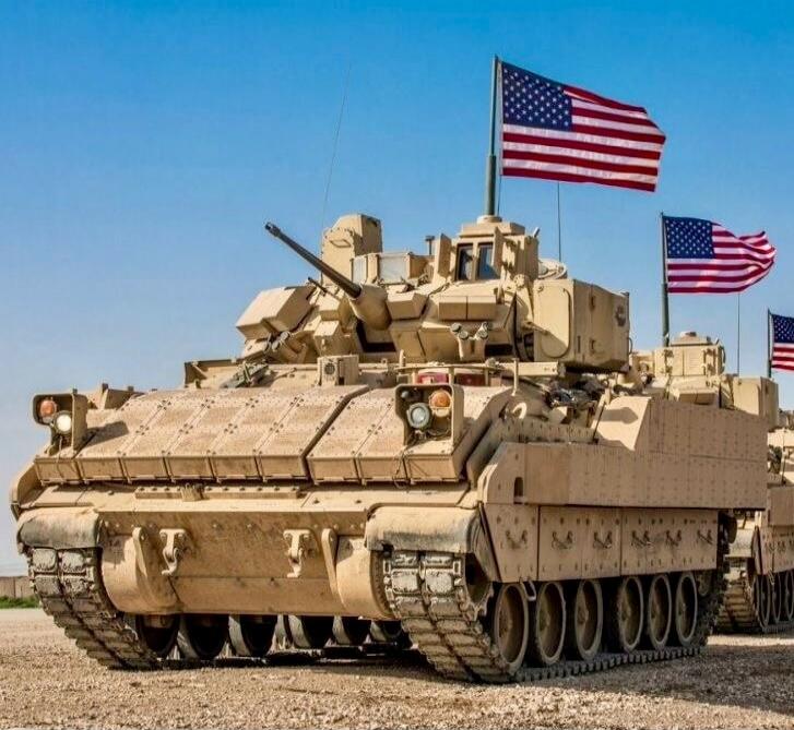 American military tanks with flags.