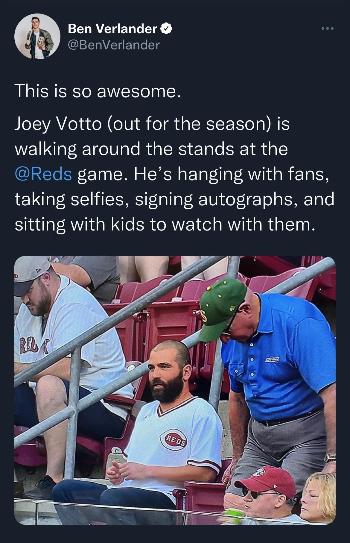 ELAEENT CERVELEN T This is so awesome Joey Votto out for the season is walking around the stands at the Reds game Hes hanging with fans taking selfies signing autographs and sitting with kids to watch with them