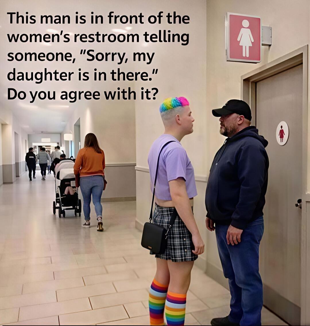 This man is in front of the women's restroom telling someone, 