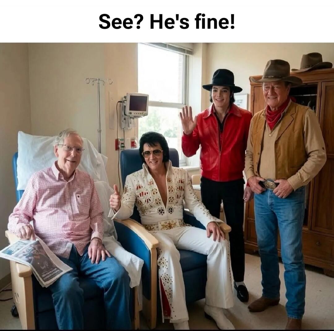 See? He's fine! An elderly man, resembling Mitch McConnell, is seated in a hospital room, holding a newspaper. He is surrounded by three men dressed as famous entertainers: Elvis Presley, Michael Jackson, and a cowboy resembling John Wayne. Elvis is giving a thumbs-up, and Michael Jackson is waving.