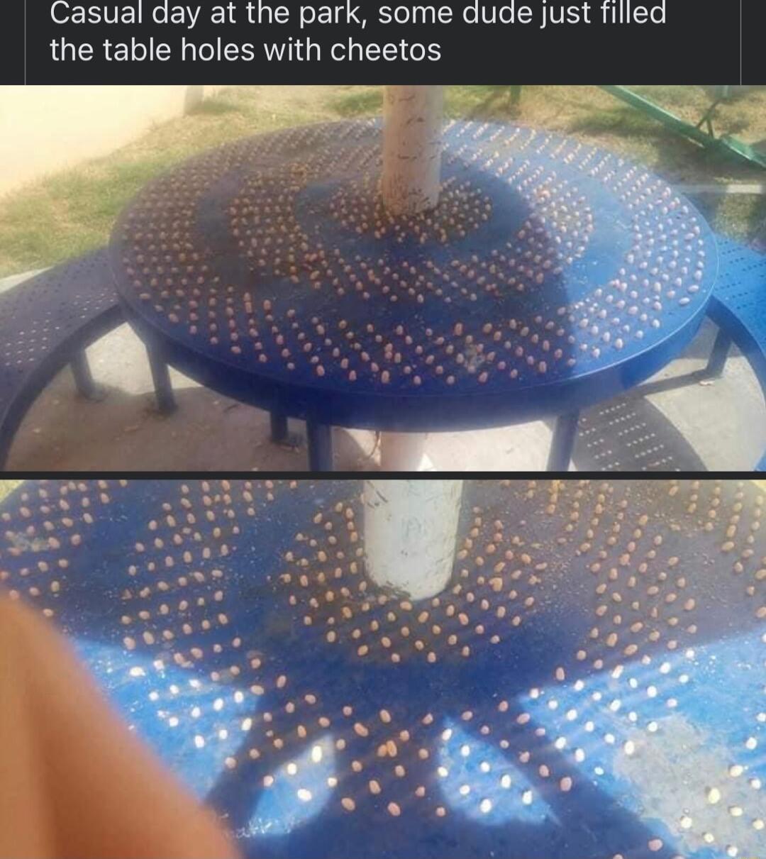 Casual day at the park some dude just filled the table holes with cheetos