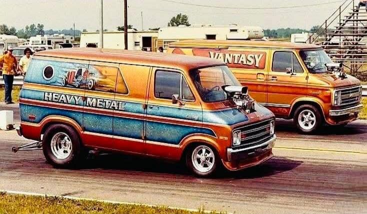 HEAVY METAL and FANTASY are visible on the custom vans.