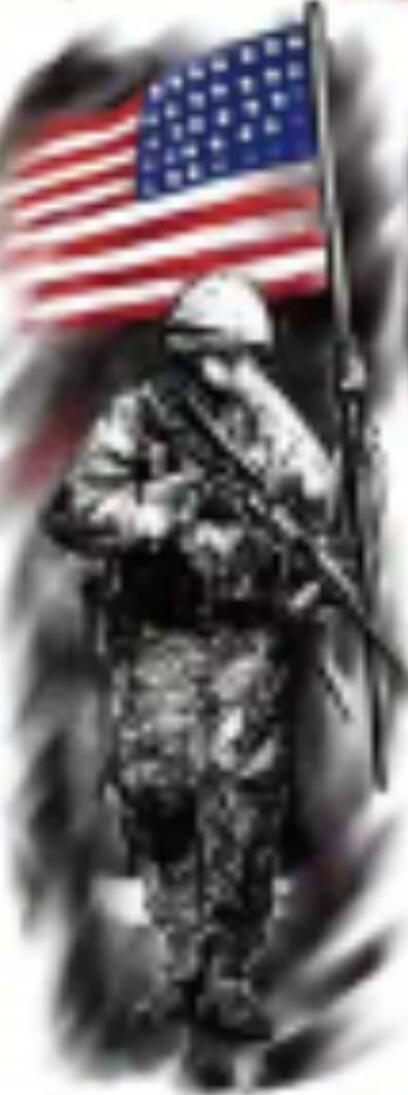 A soldier in camouflage standing with a rifle in front of an American flag.