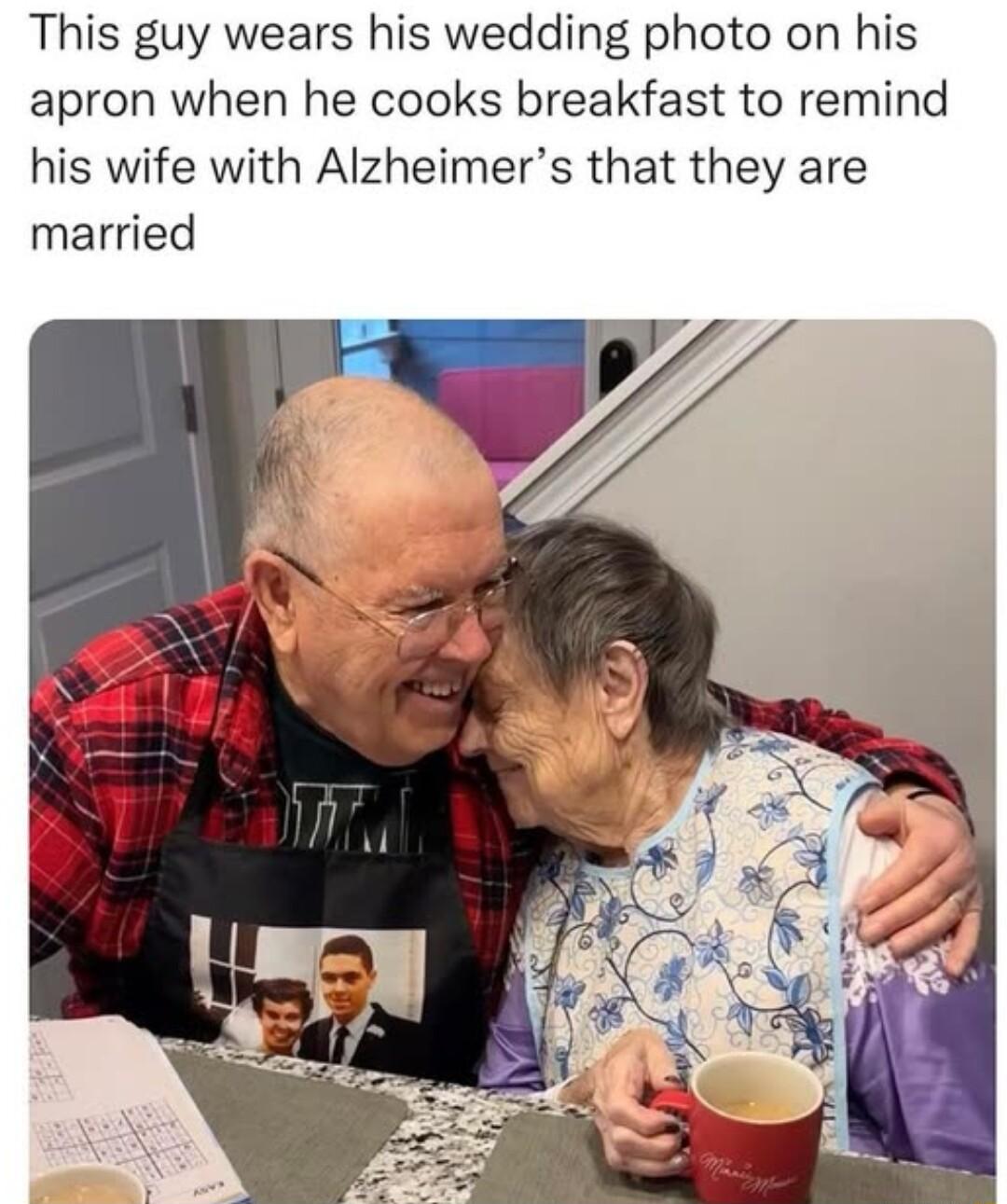 This guy wears his wedding photo on his apron when he cooks breakfast to remind his wife with Alzheimers that they are married