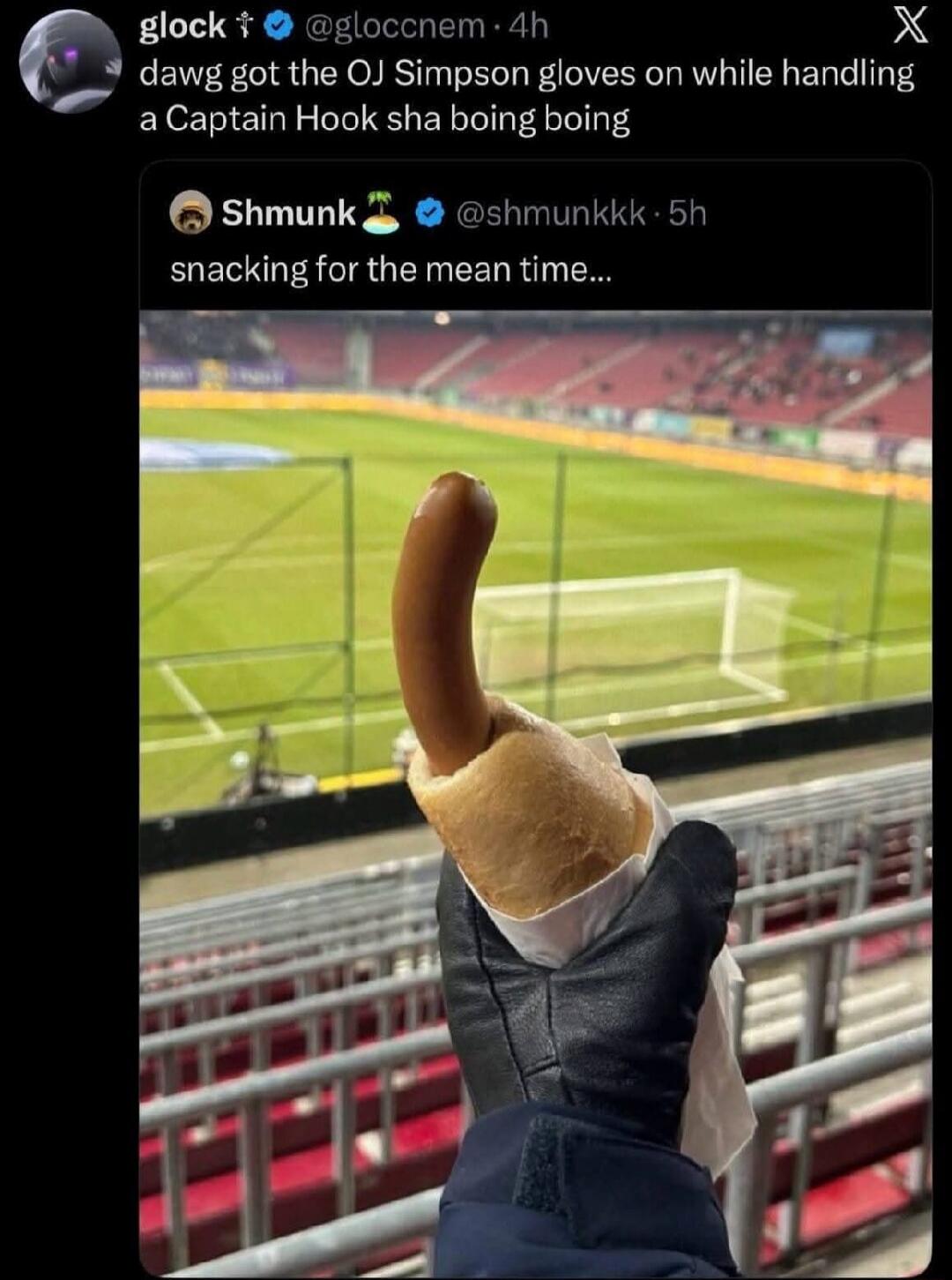 A person wearing a black glove is holding a hot dog in a bun at a football stadium. The hot dog is curved upwards, resembling a phallic shape. The text on the image reads: 'glock @gloccnem 4h dawg got the OJ Simpson gloves on while handling a Captain Hook sha boing boing' and 'Shmunk @shmunkkk 5h snacking for the mean time...'