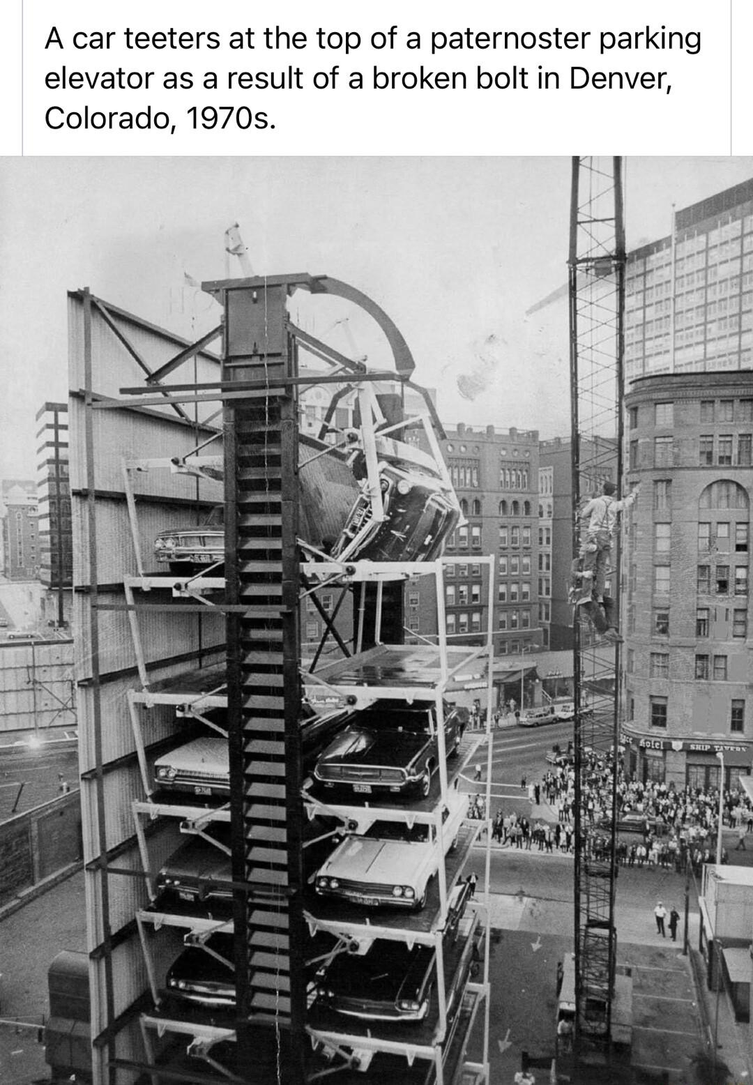 A car teeters at the top of a paternoster parking elevator as a result of a broken bolt in Denver Colorado 1970s