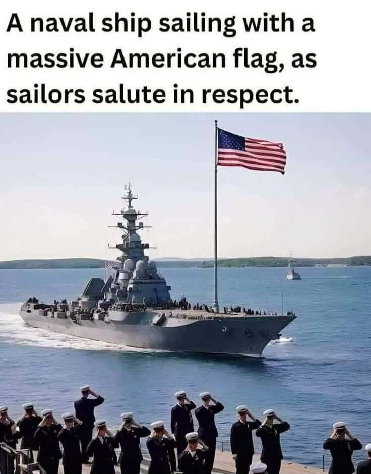 A naval ship sailing with a massive American flag, as sailors salute in respect.