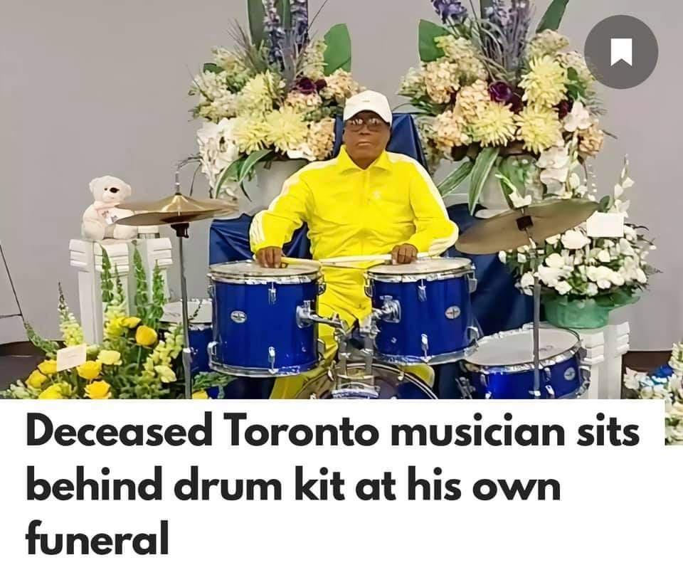 Deceased Toronto musician SItS 5 behind drum kit at his own funeral