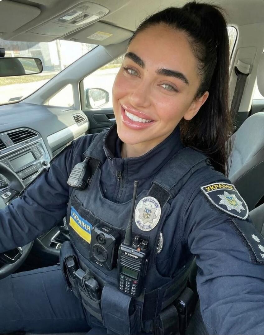 Україна patch; police badge on vest