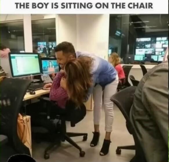 THE BOY IS SITTING ON THE CHAIR