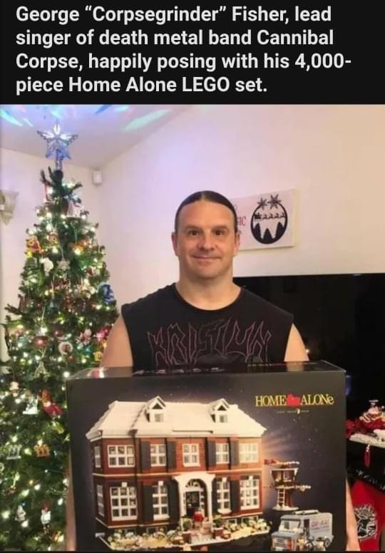 George Corpsegrinder Fisher lead BOEEE R CE O TR EEEL L EeEL L E Corpse happily posing with his 4000 piece Home Alone LEGO set