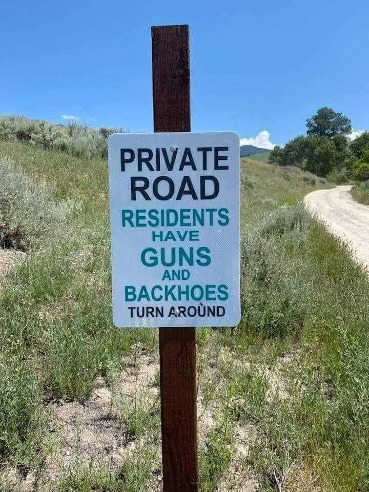 RESIDENTS HAVE GUNS AND BACKHOES TURN AROUND