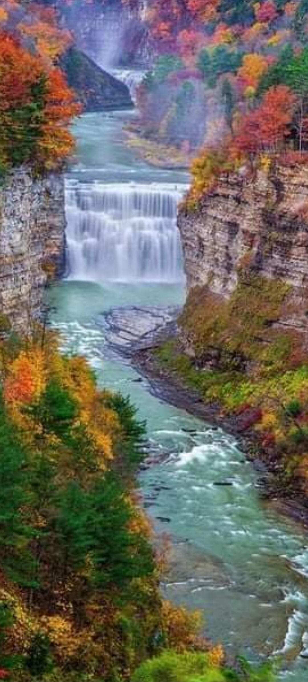 Autumn canyon with a waterfall