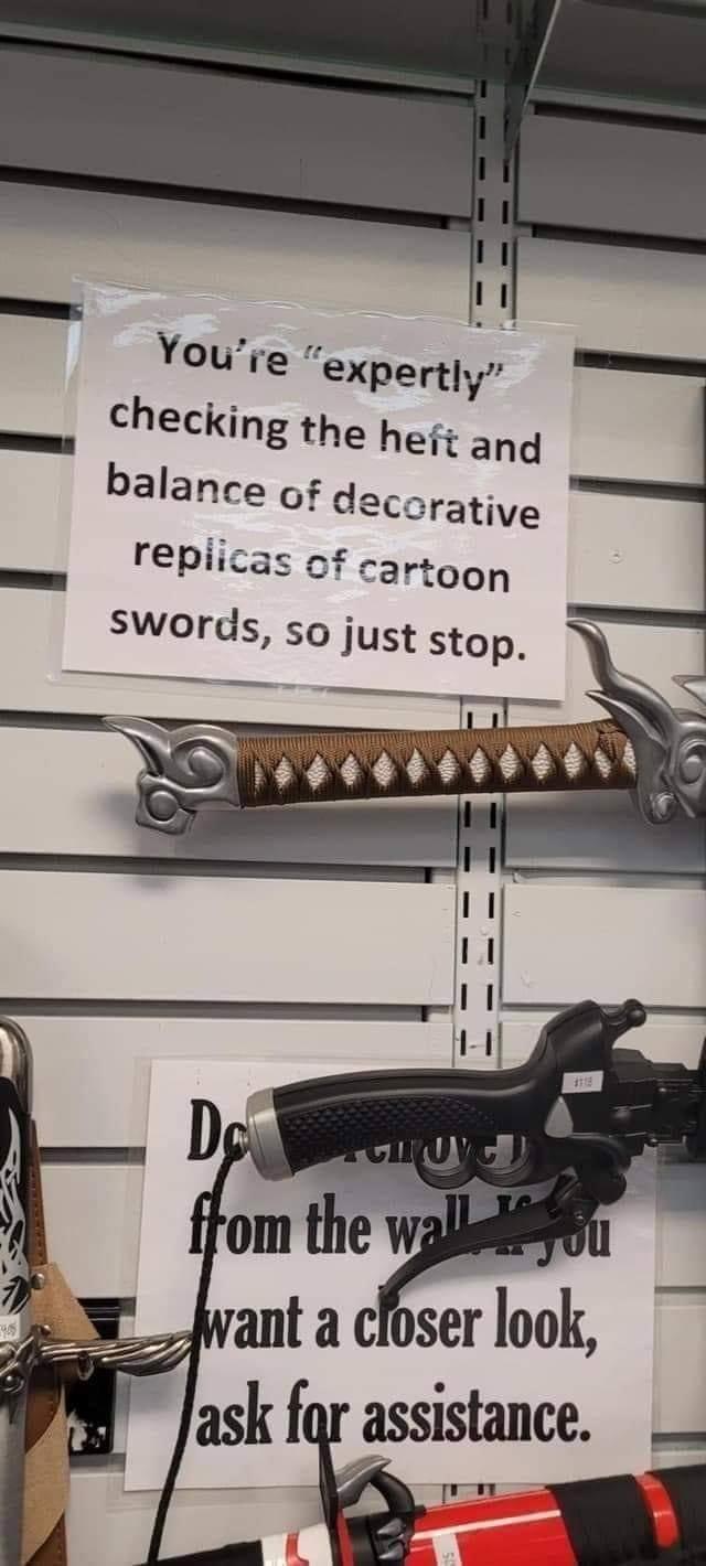 1 2 Youre expertly checking the heft ang 4 balance of decerative repiicas of cartoon swords so just stop assistance o