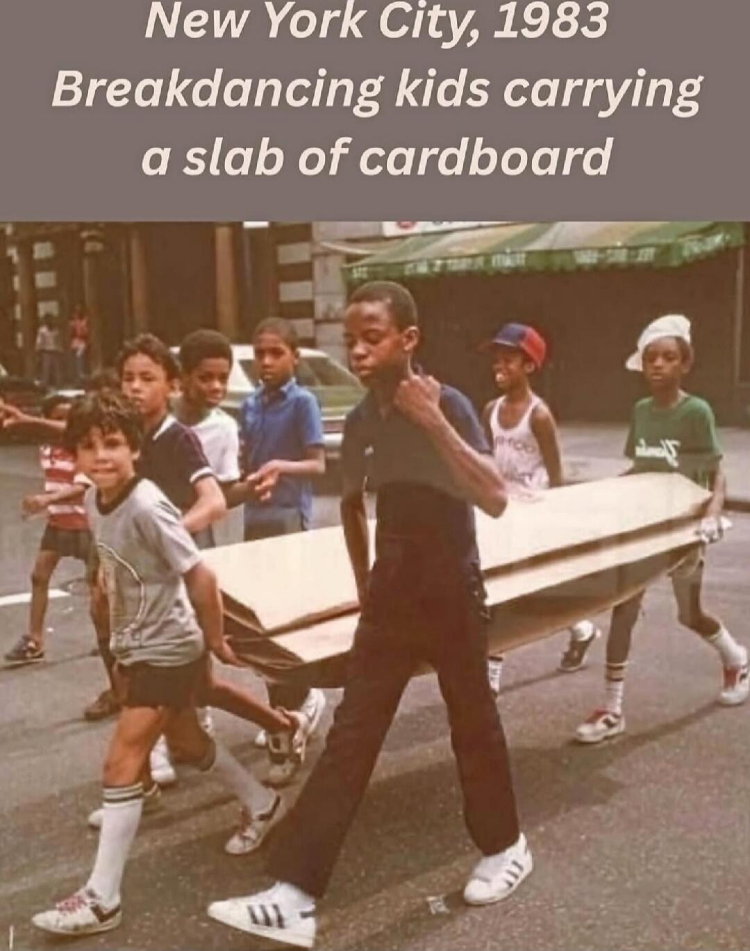 New York City, 1983 Breakdancing kids carrying a slab of cardboard