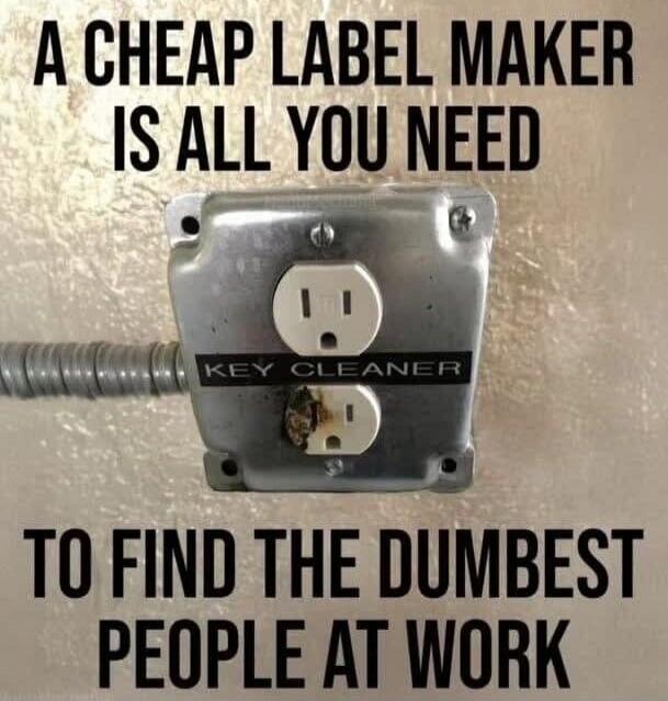 A CHEAP LABEL MAKER IS ALL YOU NEED TO FIND THE DUMBEST PEOPLE AT WORK. The label on the electrical outlet says 'KEY CLEANER'.