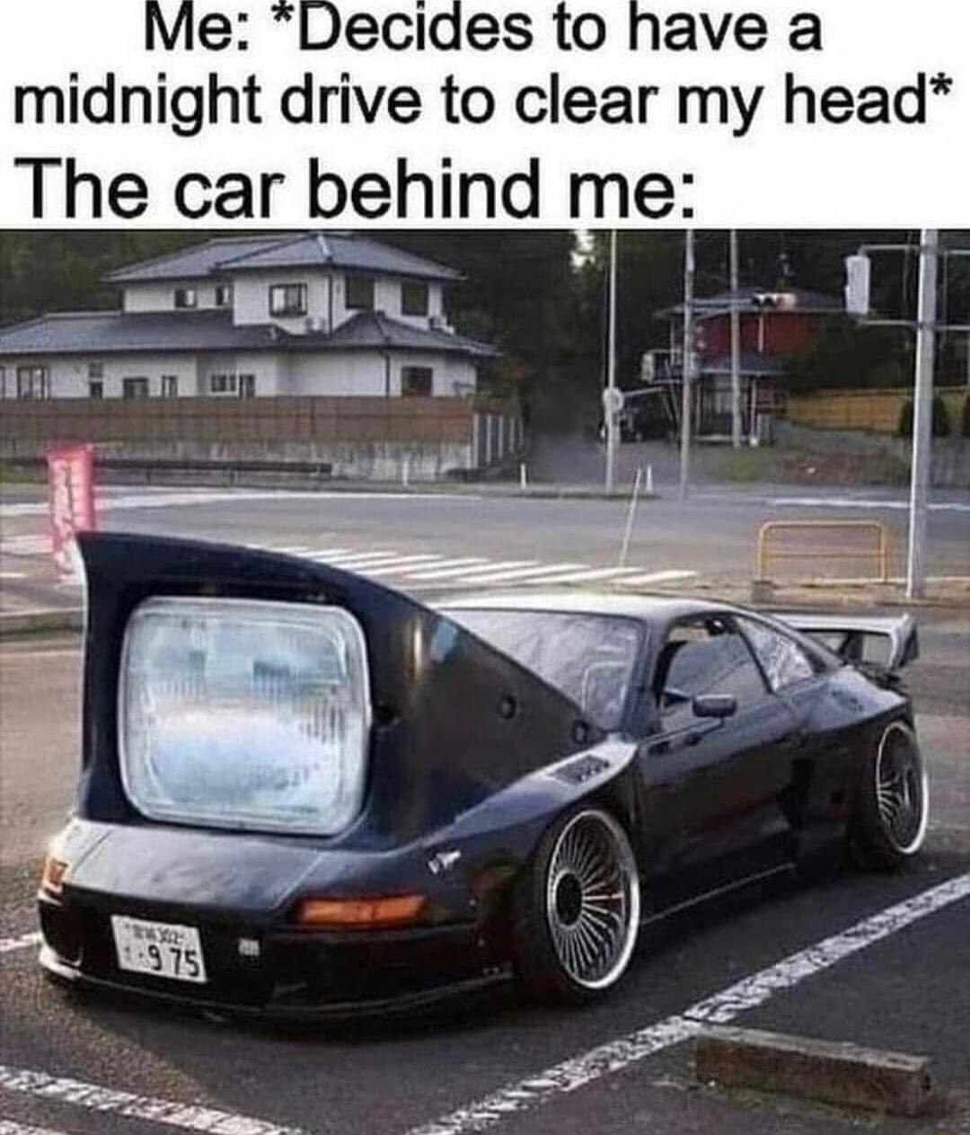 Decldes to have a midnight drive to clear my head The car ehind me