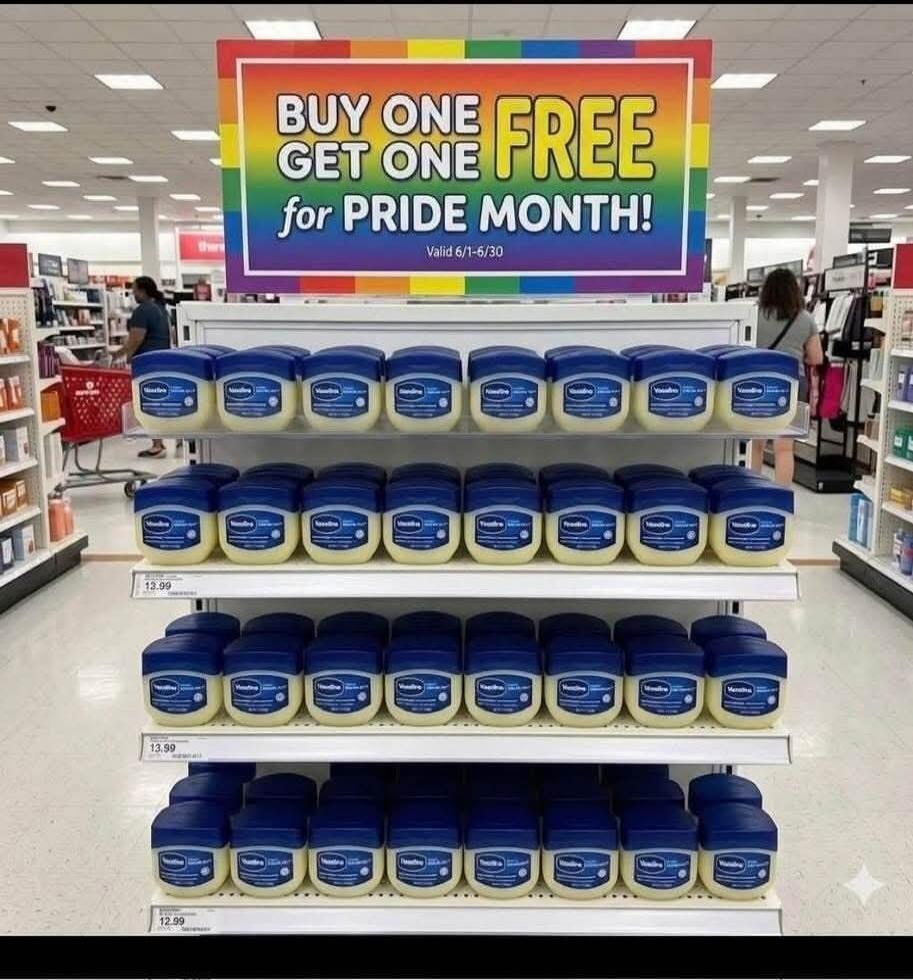 BUY ONE GET ONE FREE for PRIDE MONTH! Valid 6/1-6/30. Shelves full of Vaseline jars are displayed in a store aisle.