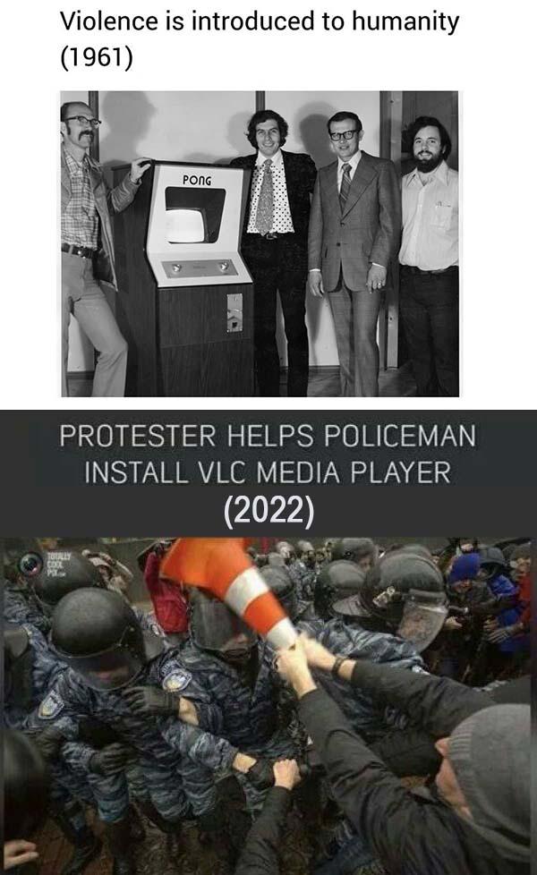 Violence is introduced to humanity 1961 PROTESTER HELPS POLICEMAN INSTALL VLC MEDIA PLAYER 2022 e
