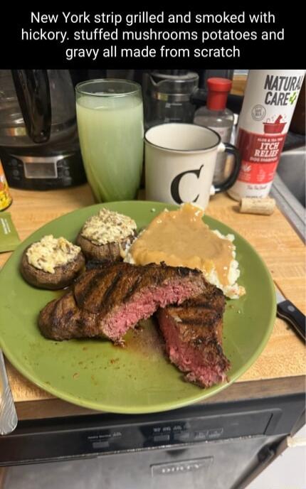 New York strip grilled and smoked with hickory stuffed mushrooms potatoes and gravy all made from scratch