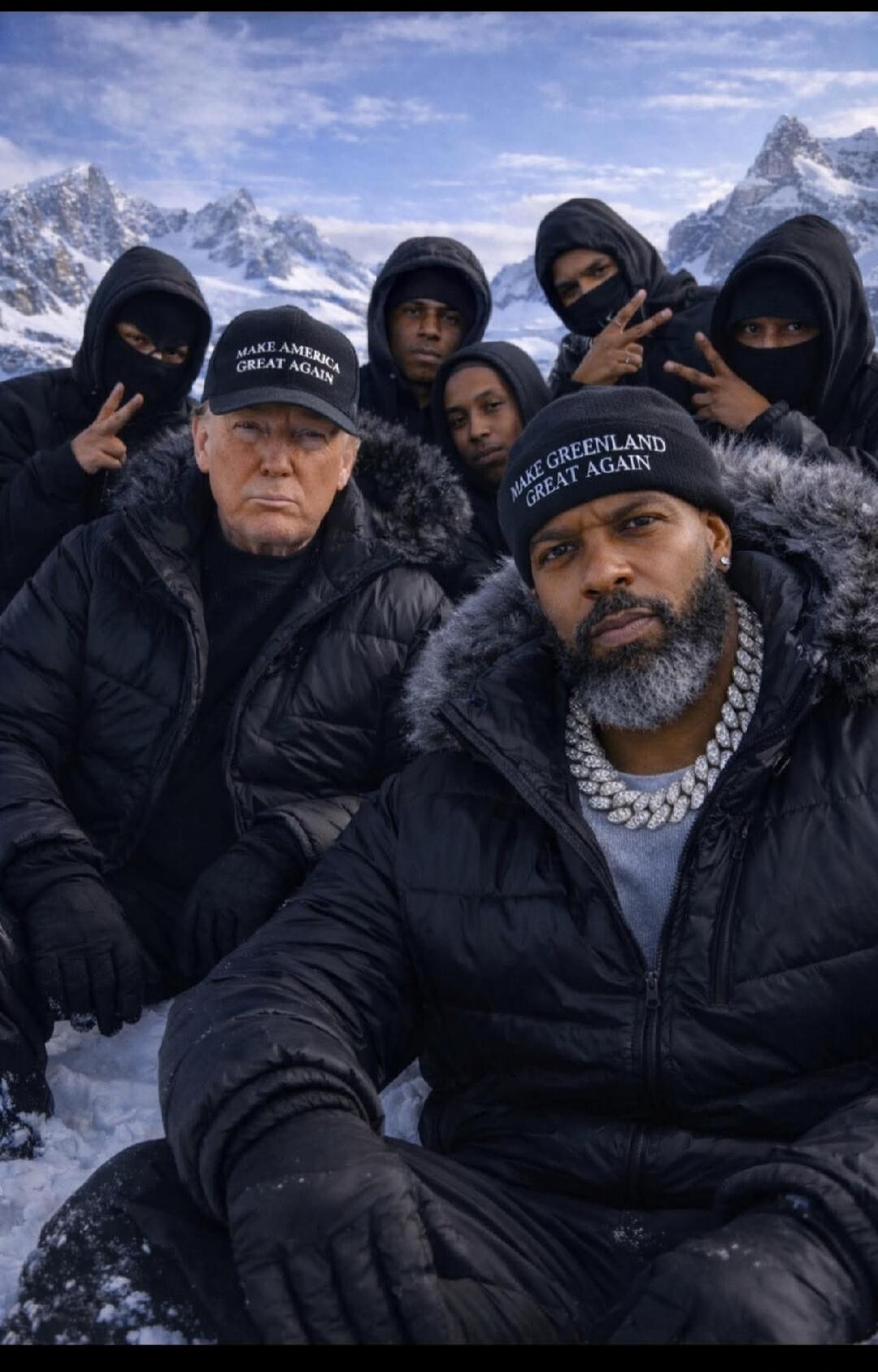 People in a snowy scene wearing black jackets and MAGA hats that read 'Make America Great Again.' There are several individuals in the background wearing black hooded outfits, some with masks, posing for a group photo.
