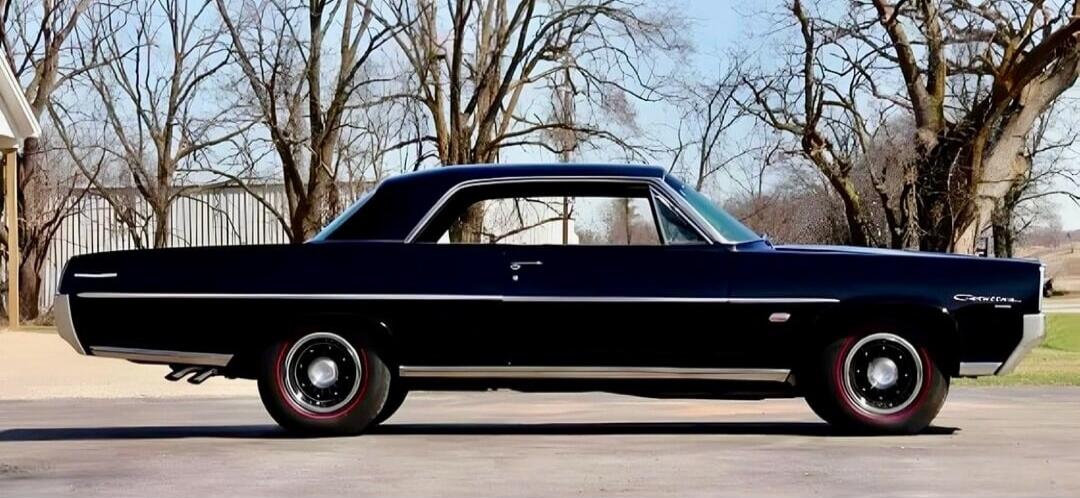 The car is a classic black Pontiac Catalina.