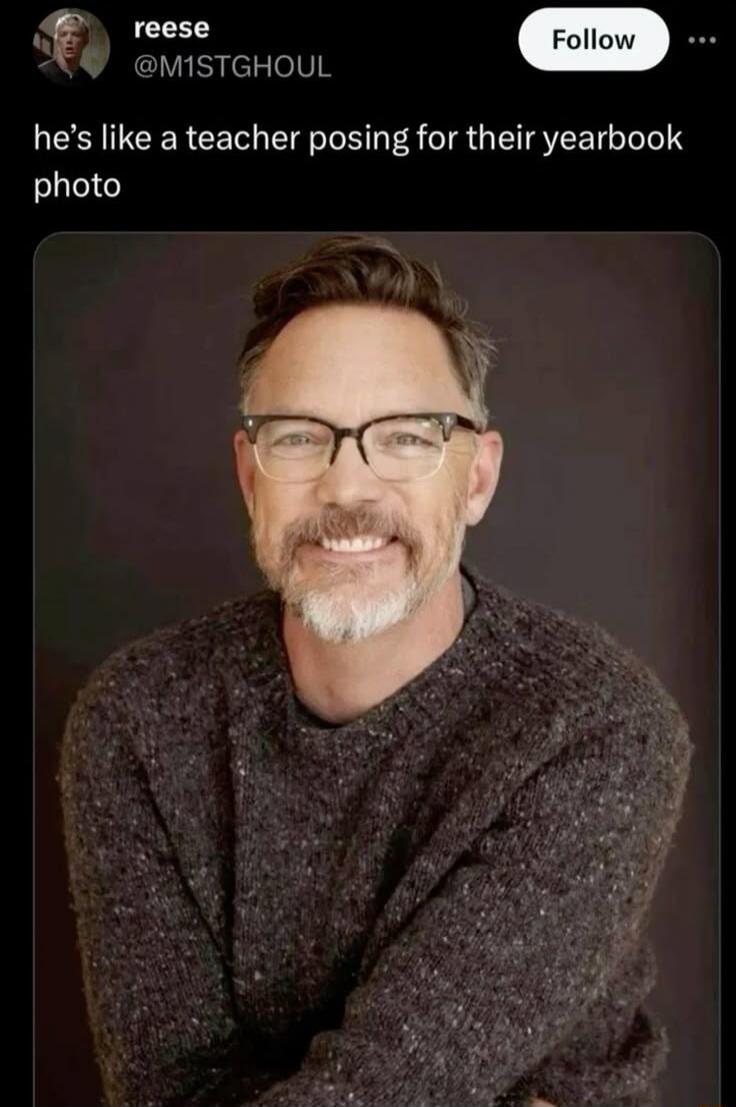 he's like a teacher posing for their yearbook photo