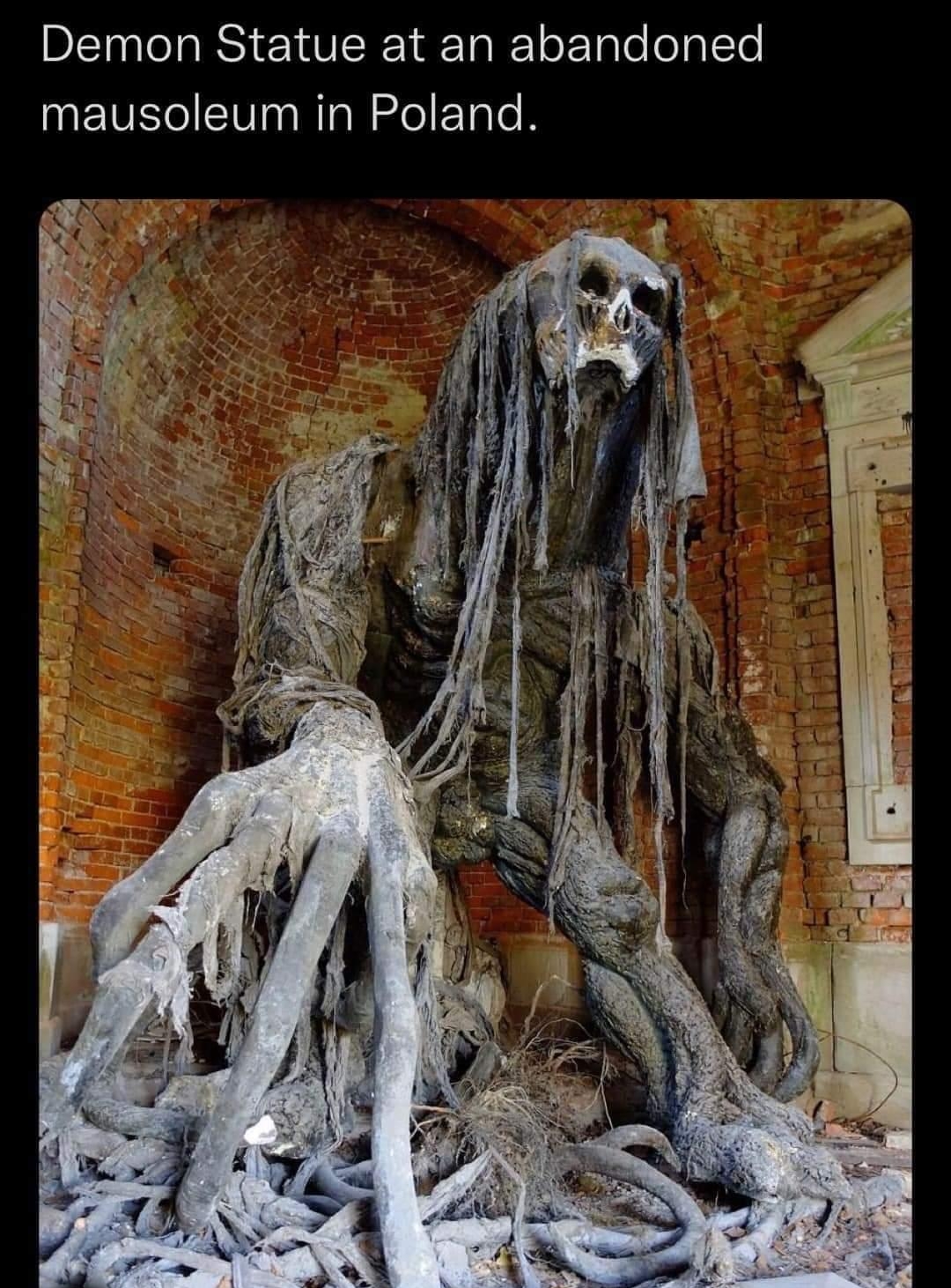 Demon Statue at an abandoned mausoleum in Poland