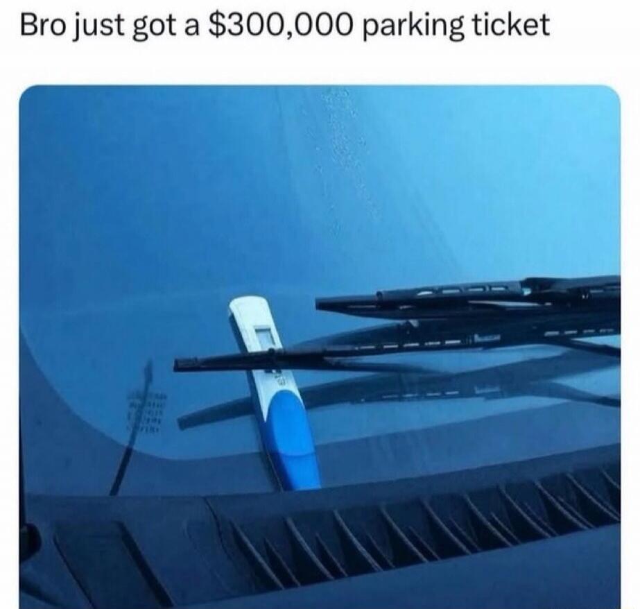 Bro just got a $300,000 parking ticket. A pregnancy test is placed under a car's windshield wiper.