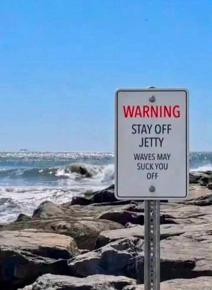 WARNING STAY OFF JETTY WAVES MAY SUCK YOU OFF