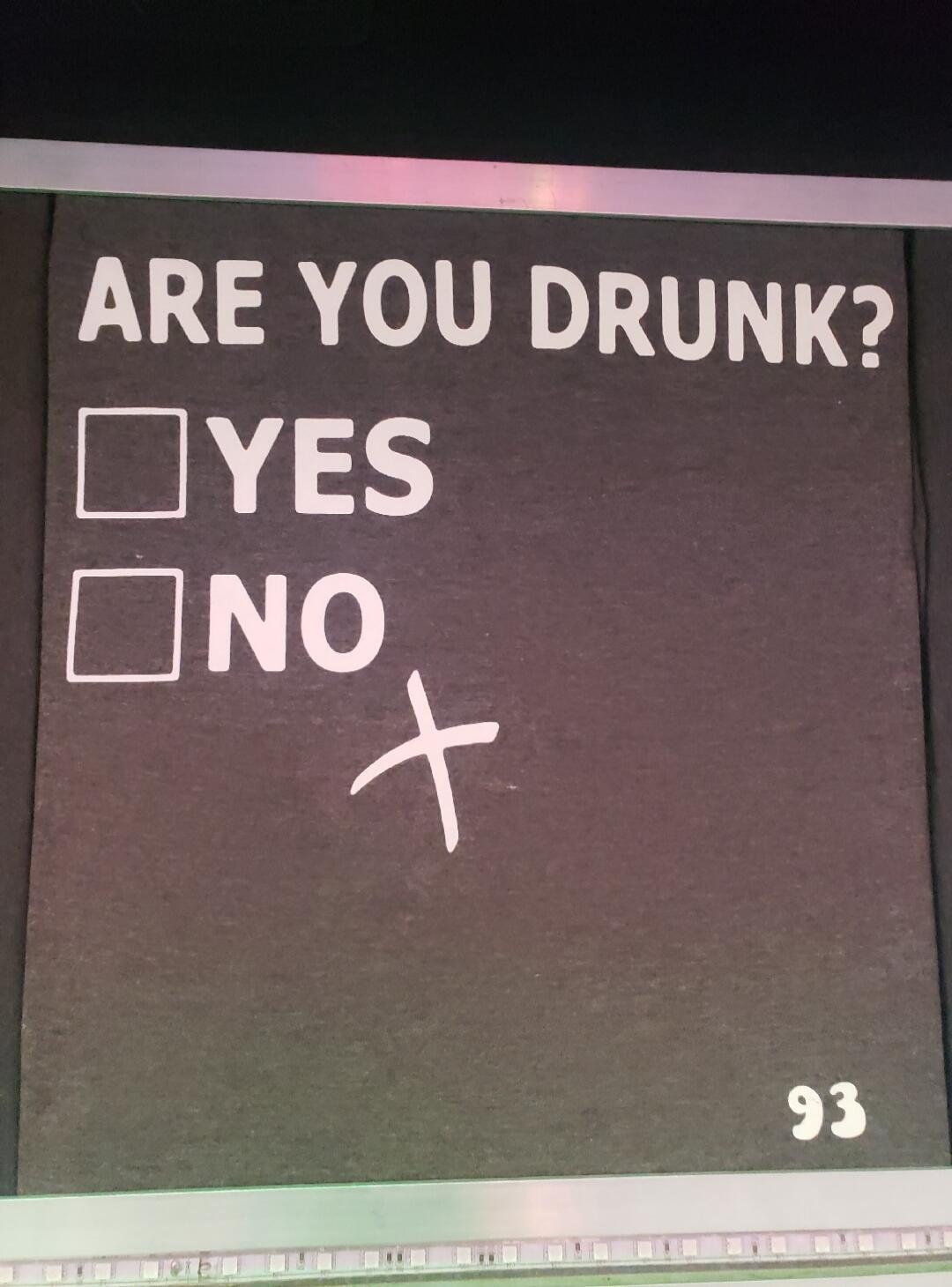 ARE YOU DRUNK? YES NO. A cross mark is drawn in the empty space, humorously avoiding a direct answer.