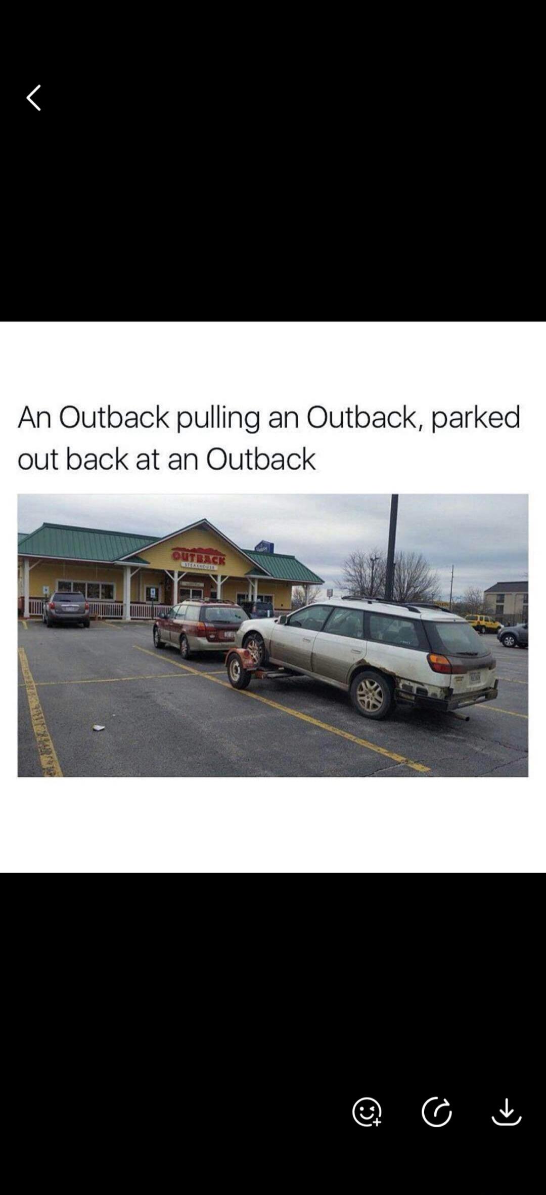 An Outback pulling an Outback, parked out back at an Outback