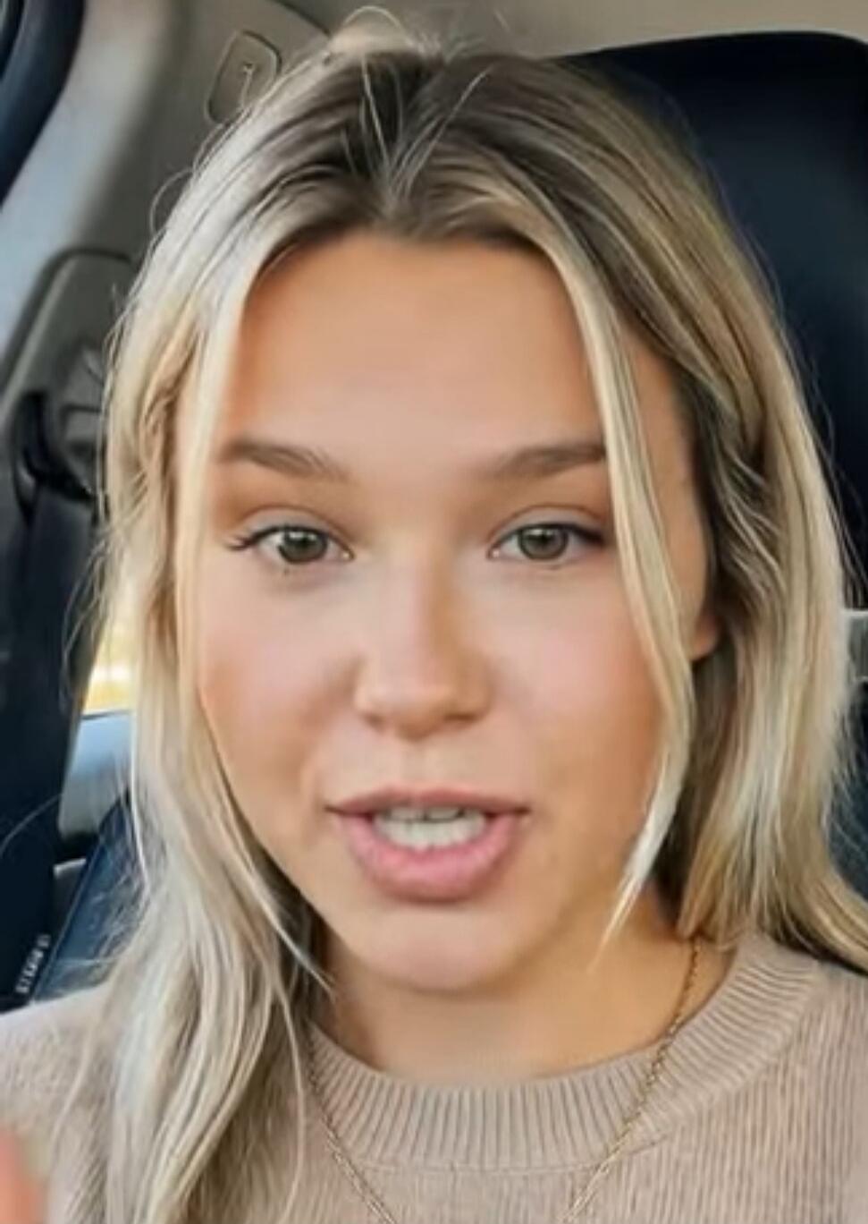 No visible text on screen. The woman appears to be speaking, but the content of her speech is unknown from a still image.