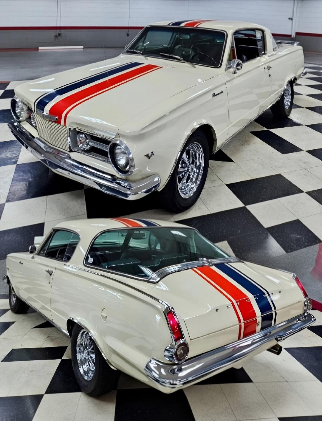 A classic white Plymouth Barracuda car with red and blue racing stripes on the hood and trunk. The car is parked on a black and white checkered floor.
