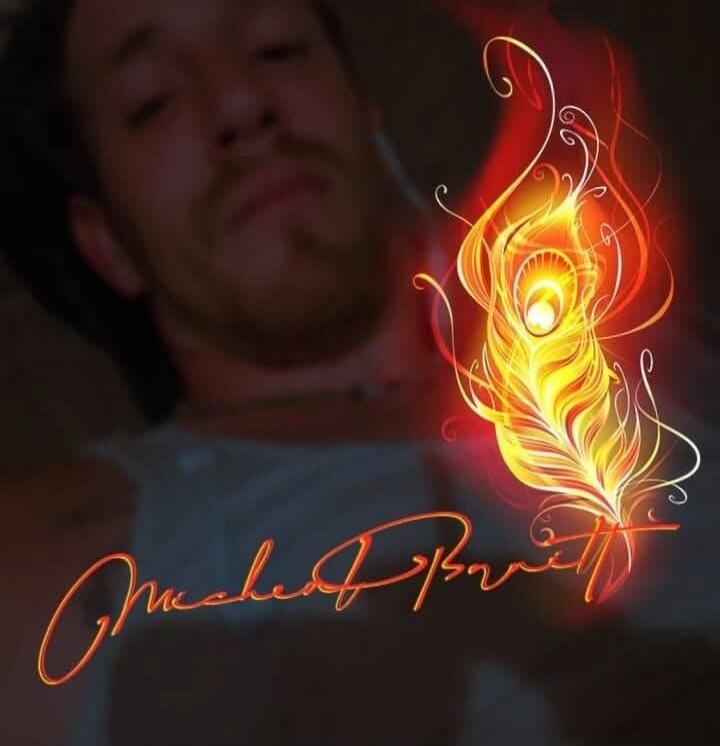 A blurry image of a man in the background with a glowing, fiery peacock feather graphic overlayed. Below the feather is a stylized signature, possibly 'Michael Barrett' or 'Michael Parrott'.