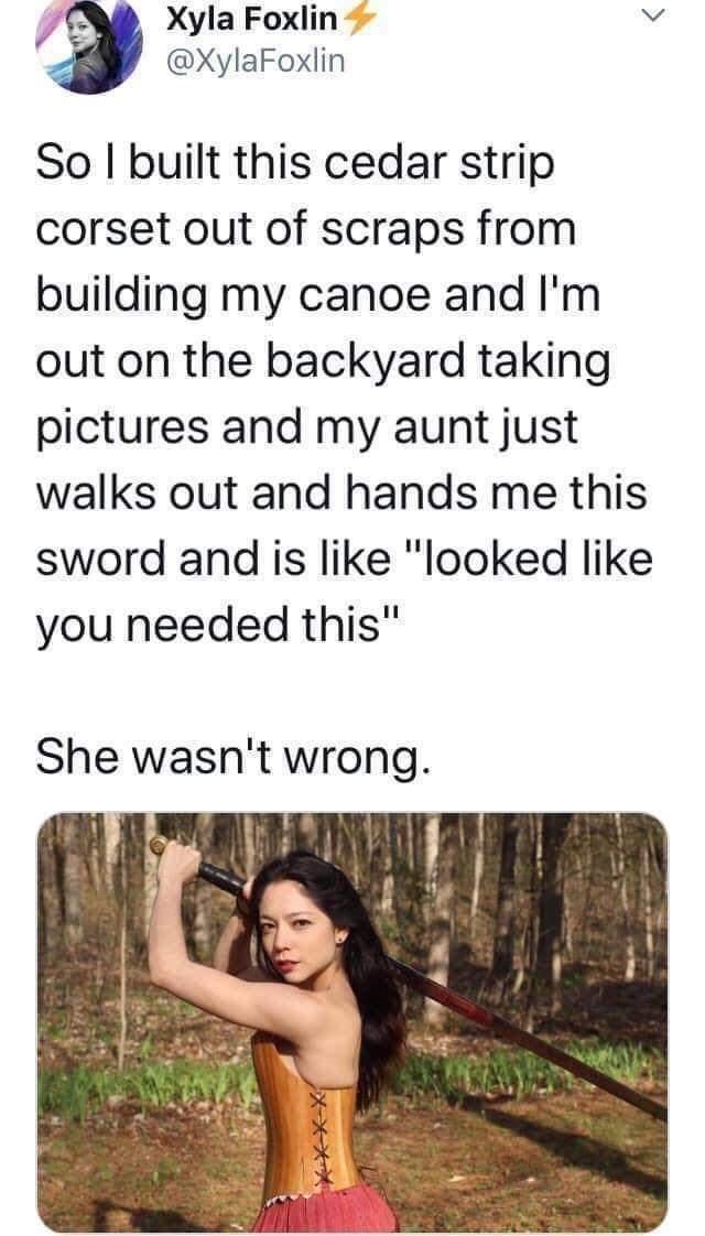 JE Xyla Foxlin v XylaFoxlin So built this cedar strip corset out of scraps from building my canoe and Im out on the backyard taking pictures and my aunt just walks out and hands me this sword and is like looked like you needed this She wasnt wrong