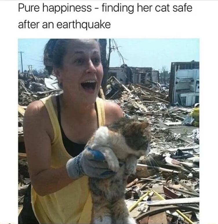 Pure happiness finding her cat safe after an earthquake
