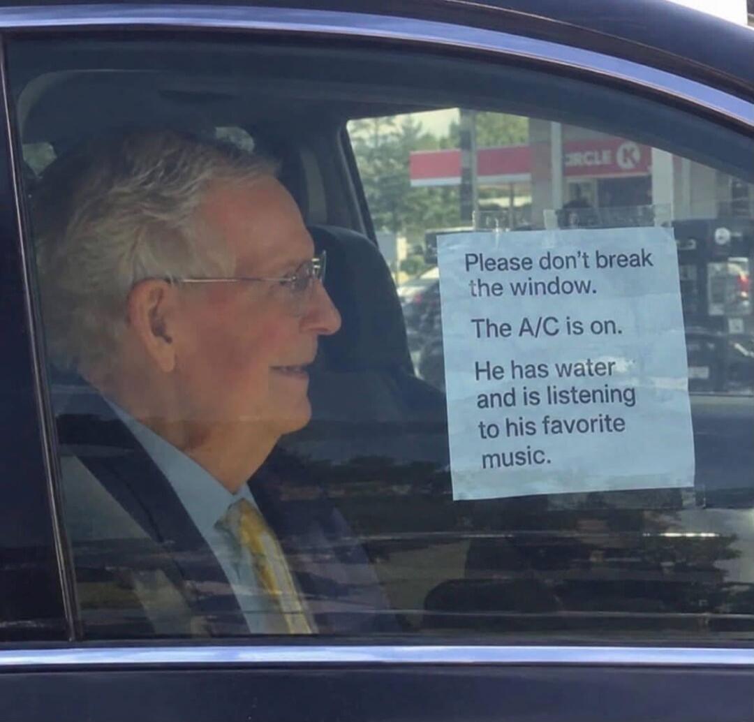 Please don't break the window. The A/C is on. He has water and is listening to his favorite music.