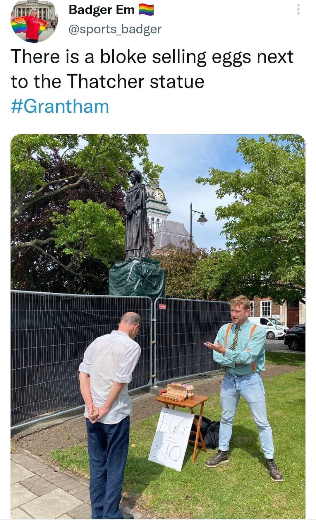 IH1 Badger Em B sports badger Thre is a bloke selling eggs next to the Thatcher statue
