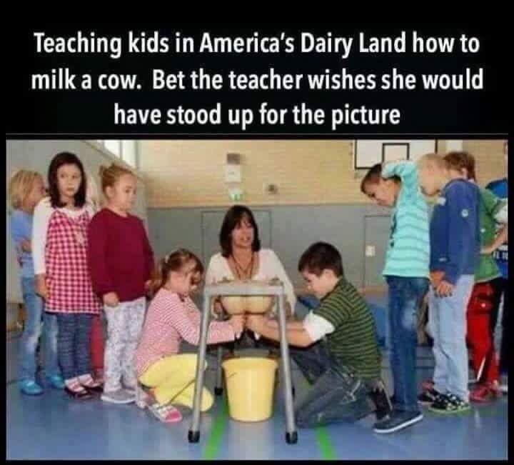 Teaching kids in Americas Dairy Land how to milk a cow Bet the teacher wishes she would