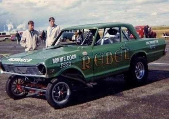 PACEMAKER BONNIE DOON ESSO REBEL. Two men standing next to a vintage green drag racing car.