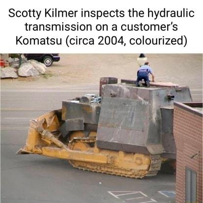 Scotty Kilmer inspects the hydraulic transmission on a customers Komatsu circa 2004 colourized