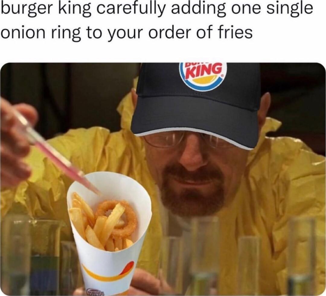 urger king carefully adding one single onion ring to your order of fries