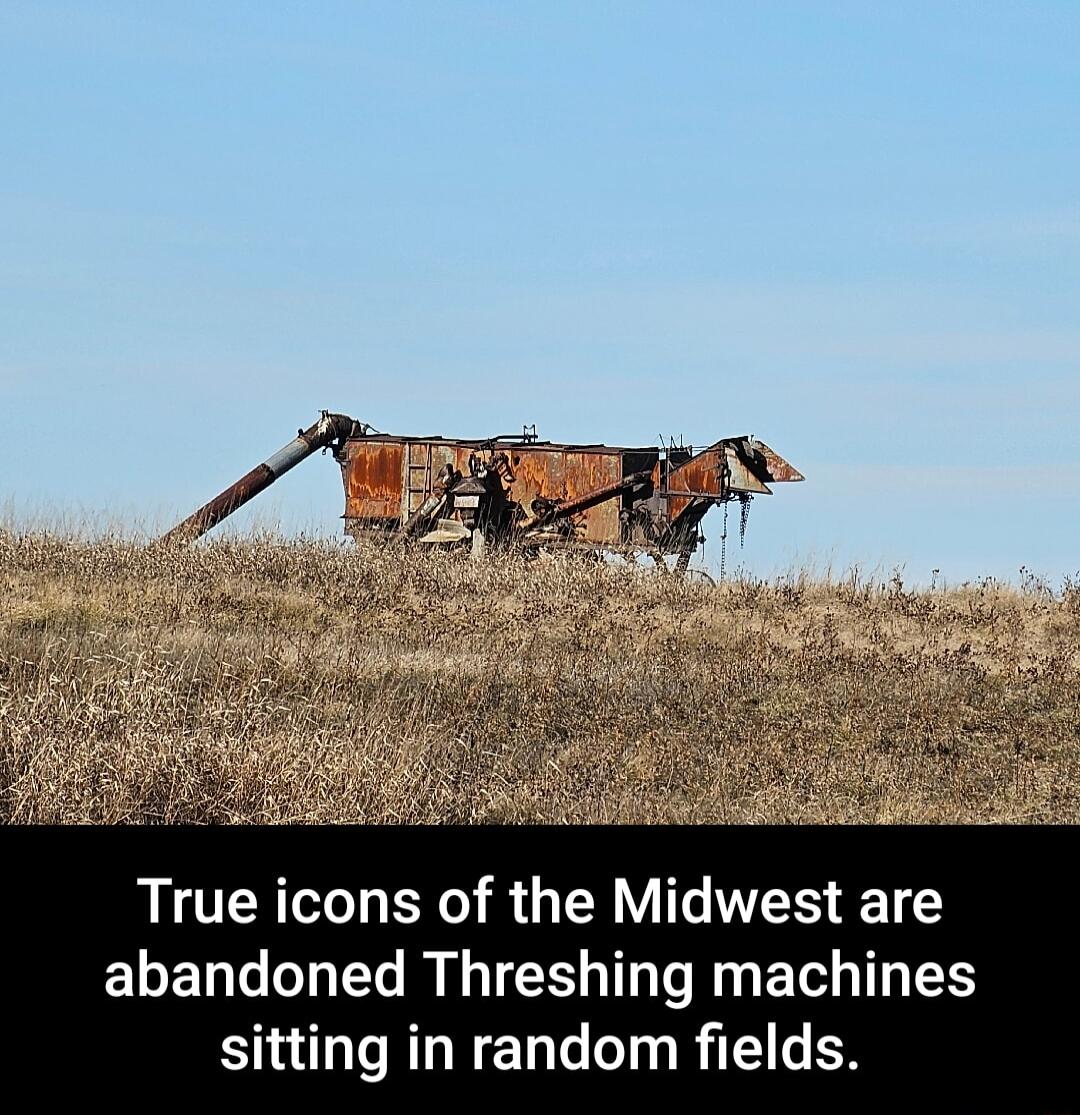 True icons of the Midwest are abandoned Threshing machines sitting in random fields
