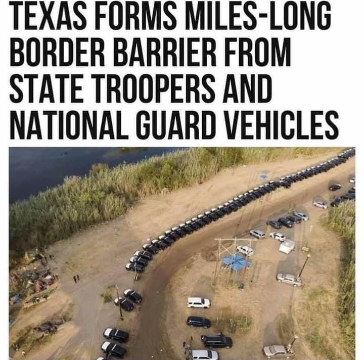 TEXAS FORMS MILES LONG BORDER BARRIER FROM STATE TROOPERS AND NATIONAL GUARD VEHICLES g