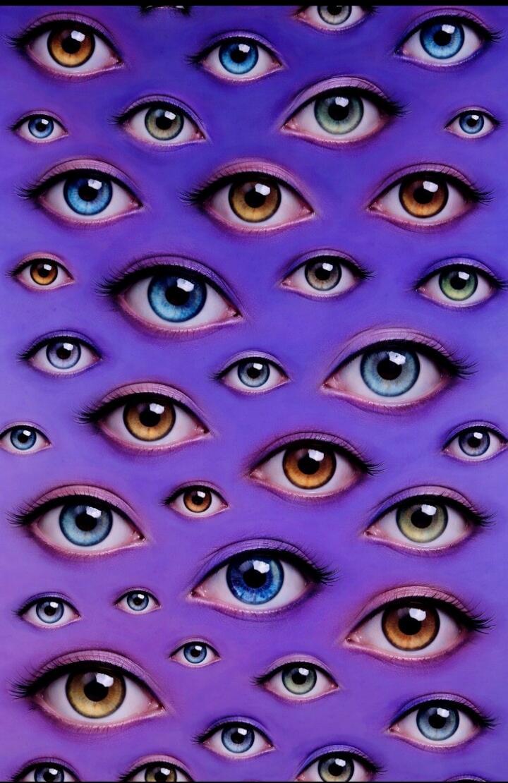 A repeating pattern of human eyes of various colors scattered across a purple background.